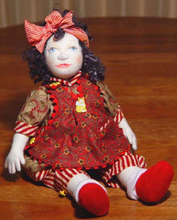 Sweet 12" button-jointed, felt baby doll with chin gusset and needle sculpted features. 