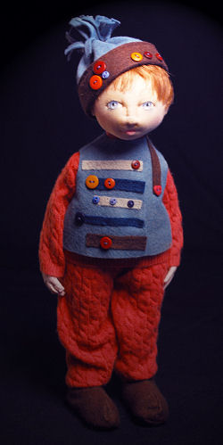 What a charming 10" fellow in his felt and button trimmed cap and vest!" - Pattern Available