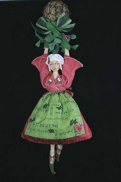 This wonderful 15" doll suspended from a grapevine ball with mistletoe - Cloth Doll Pattern Available
