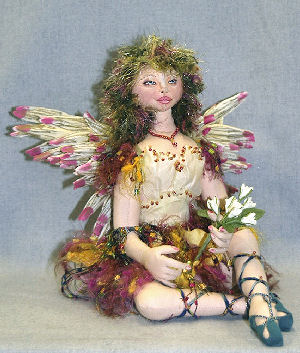 9" seated fairy is arrayed in flower petals, soft leather beaded shoes and wild yarn hair. - Doll Pattern