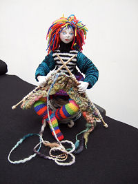 The costume for this wonderful 15”wire wrapped doll can either be knitted or sewn from old knitwear. You’ll need 1/4 yard of a knit fabric for the head and hands. Clear photos and diagrams teach you this fabulous method of dollmaking.