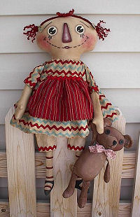 This sweet 22” raggedy is never without her 11” bear.