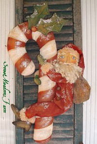 This easy Santa is hanging on tight to his 27" Candy Cane. What a super wall decoration for the holidays!