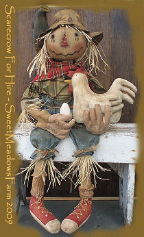 This 28" chicken-holding scarecrow features a round head and painted on sneakers.
