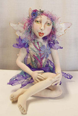 15” seated fairy is dressed in singed organza and tulle. Cloth Sewing Pattern Available