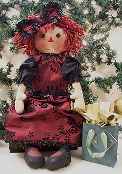 What a beautiful holiday outfit this 23” raggedy is wearing! 