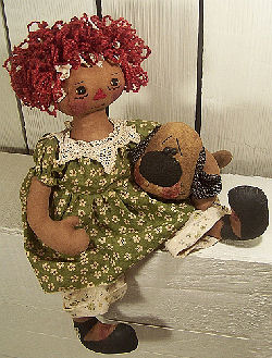 Gentle 16” raggedy with red Ricky Wacky hair loving her primitive puppy.