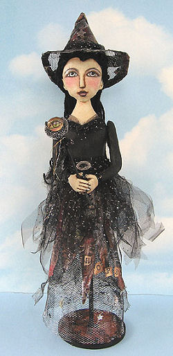 Witch - Wire mesh forms the skirt and hat of this cleverly designed 18” witch mounted on a dowel and wooden base.