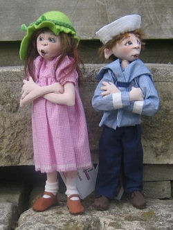 These charming male and female children can be created from one 11" doll body made from either knit or woven fabric.