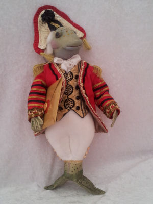 This exquisitely costumed 14" fish is going about his courtly business for the Queen of Hearts.